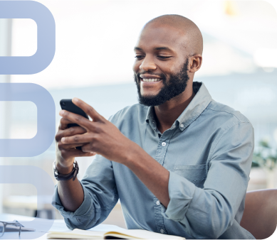 An individual sitting and holding their mobile device while using Textify's text message app.